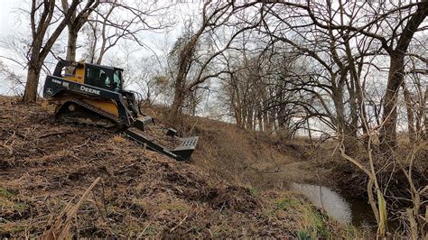 best way to clear land with skid steer|skid loader moving tree video.